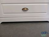 an image of a white dresser in a room
