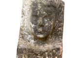 an image of a stone head on a white background