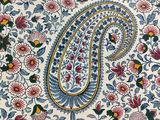 a close up of a decorative plate with a floral design on it