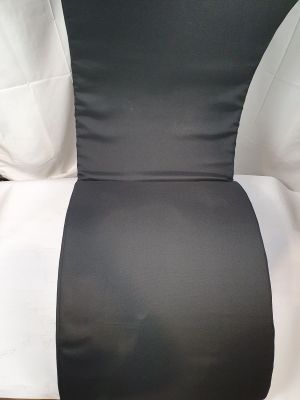 the back of a black and white chair with a white pillow on it