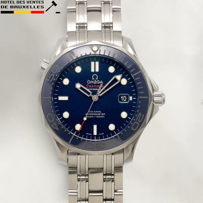 a close up of a watch on a white surface