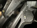 a close up of a motorcycle with a gas pump in the back