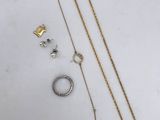 a collection of gold jewellery including a necklace, bracelet, and ring