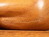 a close up of a wooden object on a table