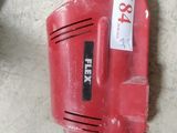 an image of a red and black corded drill