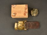 a small wooden box with a watch inside of it and a small wooden box with a watch inside of it