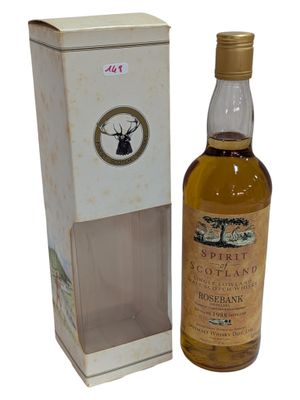 an image of a bottle of whisky sitting next to a cardboard box