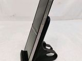 a cell phone that is sitting on a stand