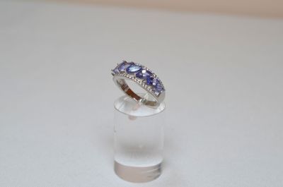 a ring that is sitting on top of a clear glass