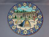 a decorative plate with a picture of a woman on it