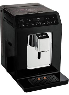 a black coffee machine sitting on top of a white counter
