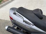 a close up of a motorcycle parked on the street