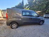 an image of a grey van parked in a parking lot