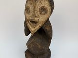 figurine of a man with a heart on his head
