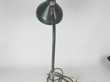 a green lamp that is on a white table