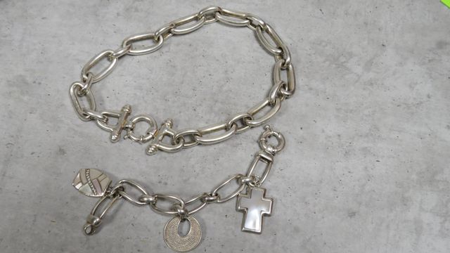Parure en argent comprenant un collier chaîne et un bracelet à dé