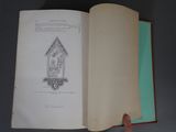 someone is holding a book open to a page with a drawing on it