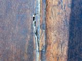 a close up of a piece of wood with a crack in it