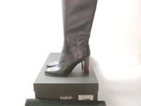 a pair of boots sitting on top of a box