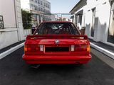 a red car parked on the side of the street