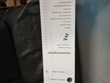 a person holding a box with a price label on it