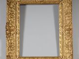 a gold frame with a decorative design on it