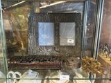 a glass display case with a couple of items in it