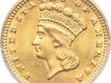 Gros plan sur une pièce d'or ornée d'une tête de femme