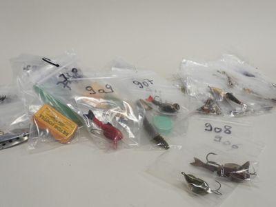 many different types of fishing lures on the table