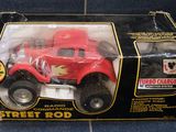 a red toy truck that is in a box