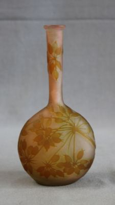 two vases sitting next to each other on a table