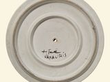 a white plate with a black writing on it