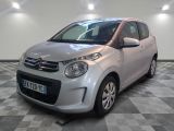 a picture of a small silver car on a checkered floor