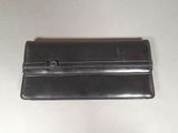 wallet on a table with a white table cloth and a white table cloth