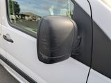 a white van with a black side mirror on the side of it