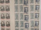 a lot of stamps on a sheet of paper with pictures of men