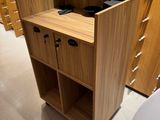 a small wooden cabinet with two drawers in the middle