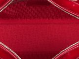 the inside of a red purse with a zipper on it