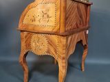 an image of a small wooden desk with a clock on top of it