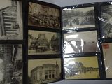 a lot of old postcards on the table