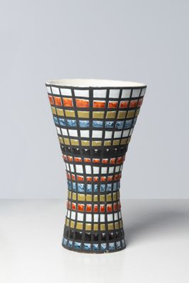 a vase that has a colorful design on it