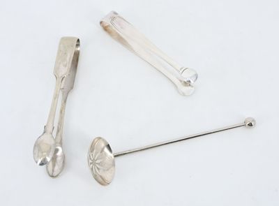 two spoons and a spoon rest next to each other