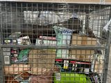 a large metal cage filled with lots of food