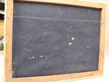 a picture of a blackboard with a wooden frame on it