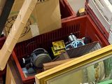 a pile of assorted items in a box on the floor