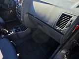 the interior of a car with a dashboard and steering controls