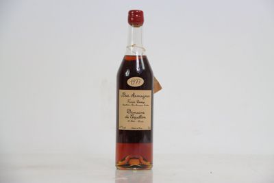 an image of a bottle of liquor sitting on top of a table