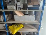 a shelf with boxes and boxes on it in a room