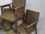 three chairs that are sitting next to each other
