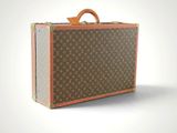 a brown and tan suitcase sitting on top of a white surface